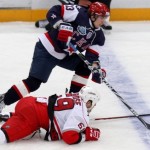 SKA St. Petersburg's Shitikov fights for the puck with Carolina Hurricanes' LaRose during their international friendly ice hockey game in St. Petersburg