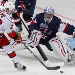 SKA St. Petersburg's goalie Nabokov makes a save on Carolina Hurricanes' Dalpe during their international friendly ice hockey game in St. Petersburg