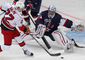SKA St. Petersburg's goalie Nabokov makes a save on Carolina Hurricanes' Dalpe during their international friendly ice hockey game in St. Petersburg